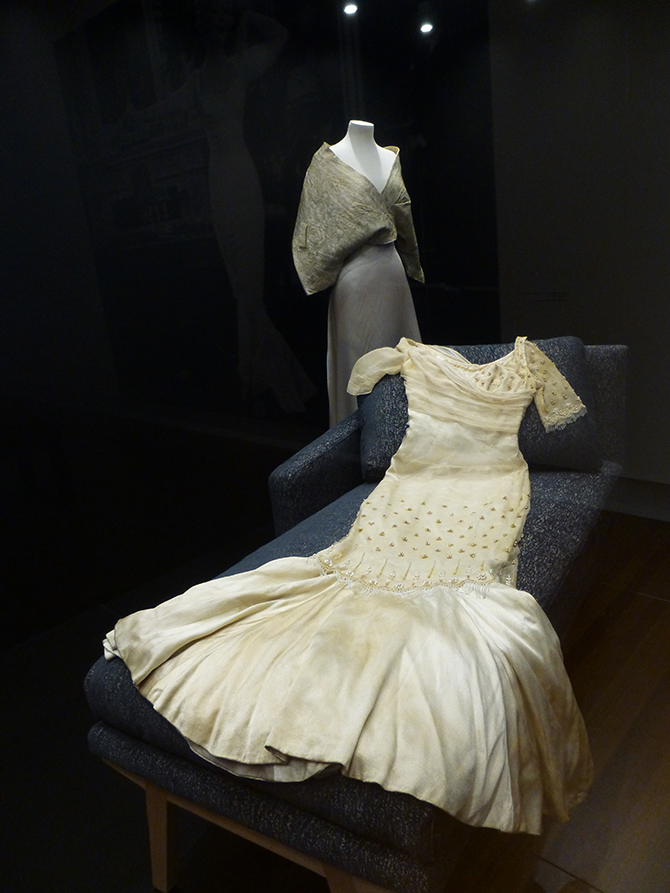 Beatrice Dawson (1908-76), designer, Evening gown (1957), silk satin, chiffon, glass beads, sequins; worn by Monroe in The Prince and the Showgirl (Lord Laurence Olivier, 1957). (Collection of Greg Schreiner, Los Angeles). (rear) Unknown, Brocade evening cape (c.1955), silk; worn by Monroe to an Actor's Studio benefit screening of East of Eden (Elia Kazan, 1955) in New York, 1955. (Scott Fortner, The Marilyn Monroe Collection, California). Installation photo: Inga Walton.